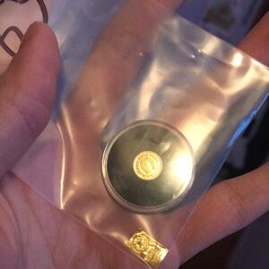 Gold and Black Coin in Protective Case